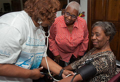 photo of women having blood pressure taken