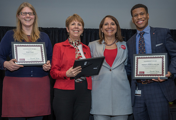 Dean Melnyk poses with award winners holding their certificates at the annual State of Health and Wellness address